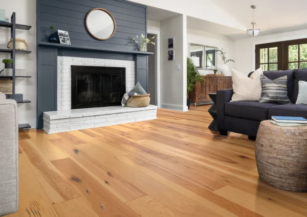 Spacious modern living room featuring a fireplace and hardwood flooring
