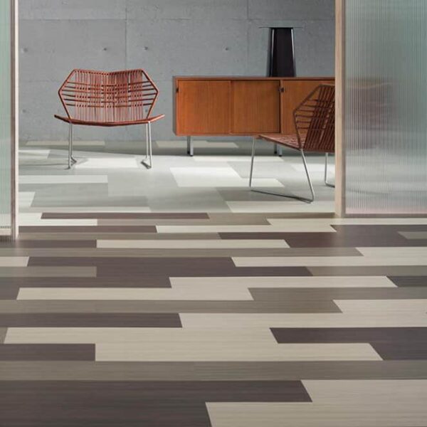 Contemporary room featuring stylish patterned vinyl flooring and mid-century furniture.